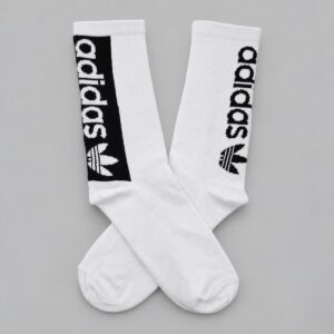 Medias Adidas blancas franja negra — Vista principal sobre fondo gris